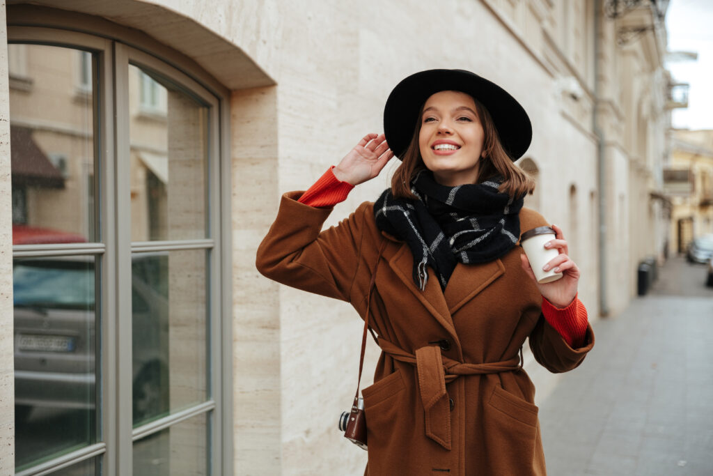 Portrait of a smiling girl dressed in autumn clothes
